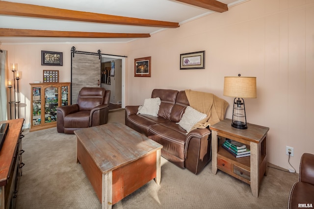 carpeted living room featuring lofted ceiling with beams and a barn door