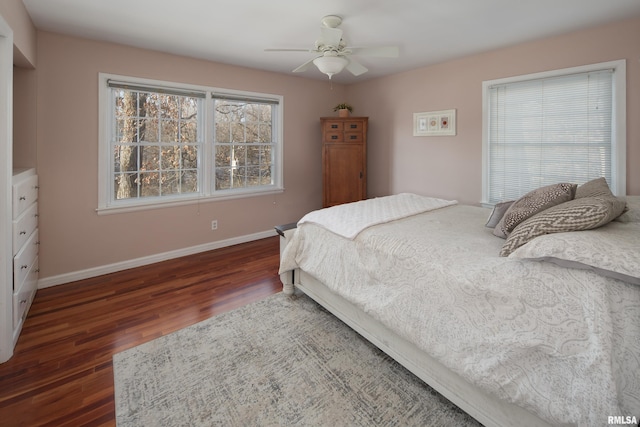 bedroom featuring ceiling fan and dark wood-type flooring