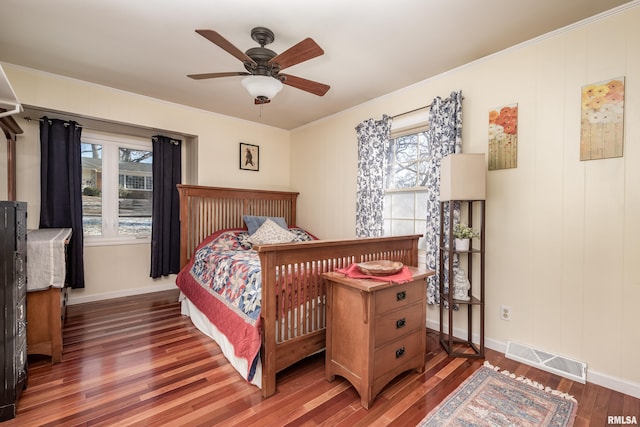 bedroom featuring ceiling fan and dark hardwood / wood-style flooring