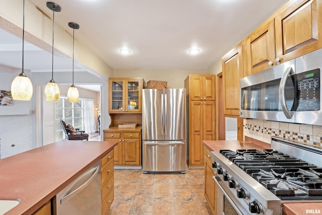 kitchen with recessed lighting, glass insert cabinets, backsplash, stainless steel appliances, and pendant lighting