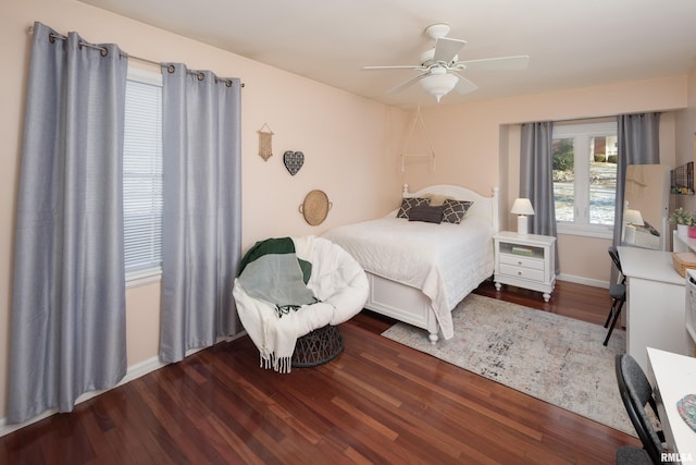 bedroom featuring dark hardwood / wood-style flooring and ceiling fan