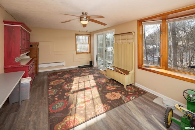 interior space with ceiling fan, dark wood-type flooring, and a baseboard radiator