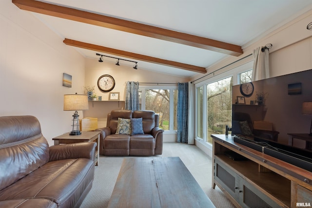 living area with carpet flooring and lofted ceiling with beams