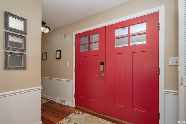 foyer entrance with dark hardwood / wood-style flooring