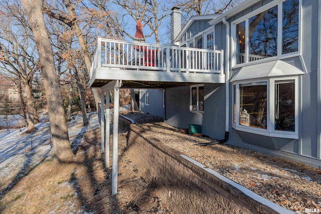 view of side of property with a deck