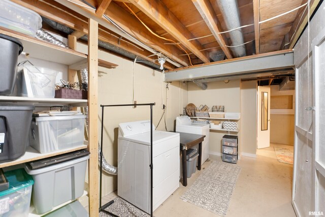 laundry room featuring independent washer and dryer and laundry area