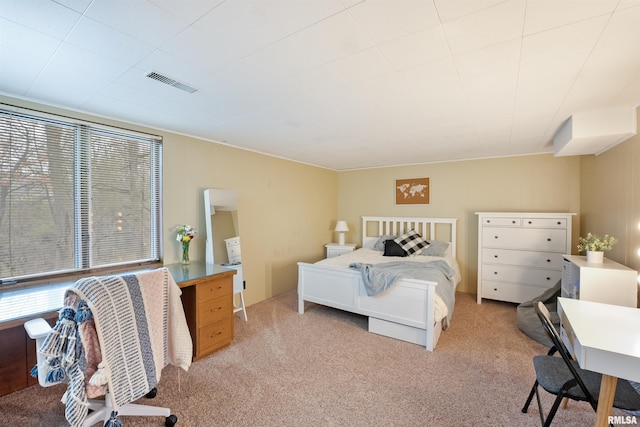 bedroom with visible vents and light colored carpet