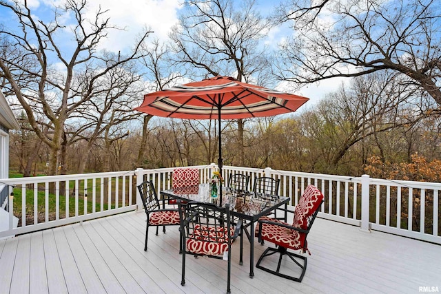 wooden terrace with outdoor dining space