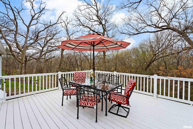 wooden terrace featuring outdoor dining area
