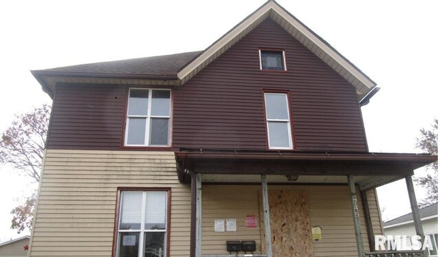 rear view of house with a porch