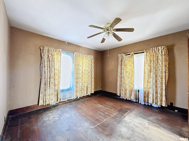 unfurnished room with ceiling fan and wood-type flooring