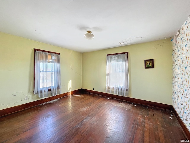 unfurnished room featuring wood-type flooring