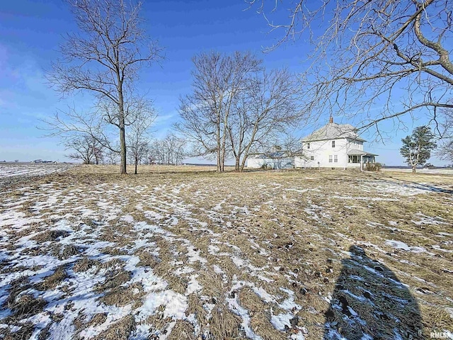 view of yard layered in snow