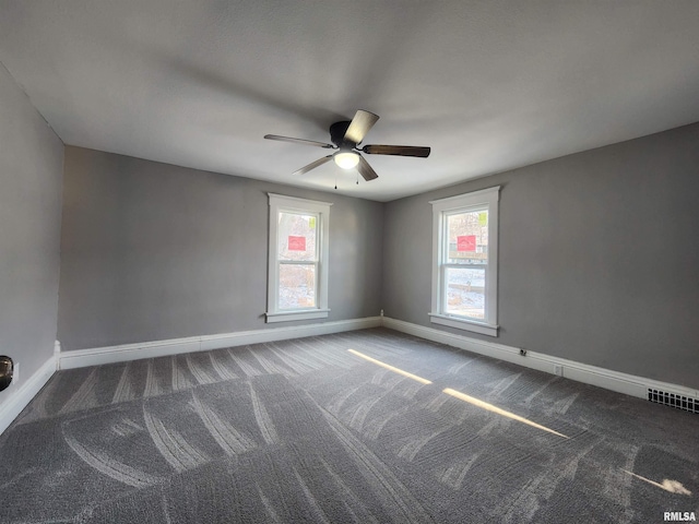 spare room featuring carpet flooring and ceiling fan