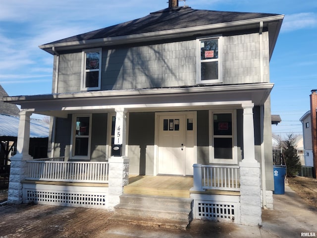 view of front of house featuring central AC unit and a porch