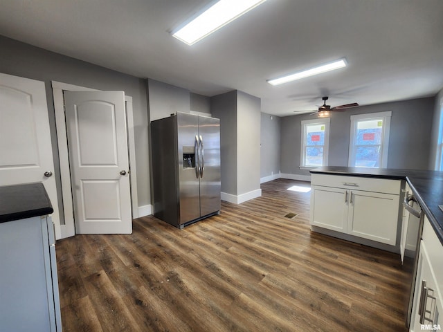 kitchen featuring ceiling fan, dark hardwood / wood-style flooring, white cabinetry, and appliances with stainless steel finishes