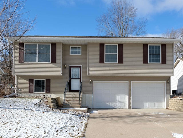 bi-level home featuring a garage