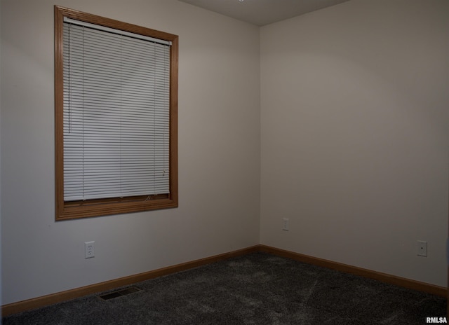 unfurnished room with carpet flooring