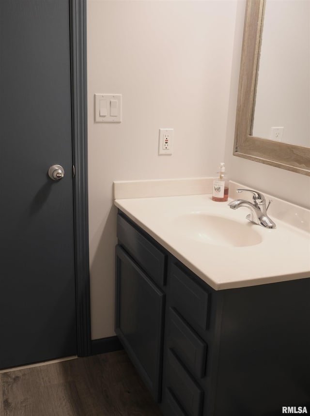 bathroom featuring vanity and wood-type flooring