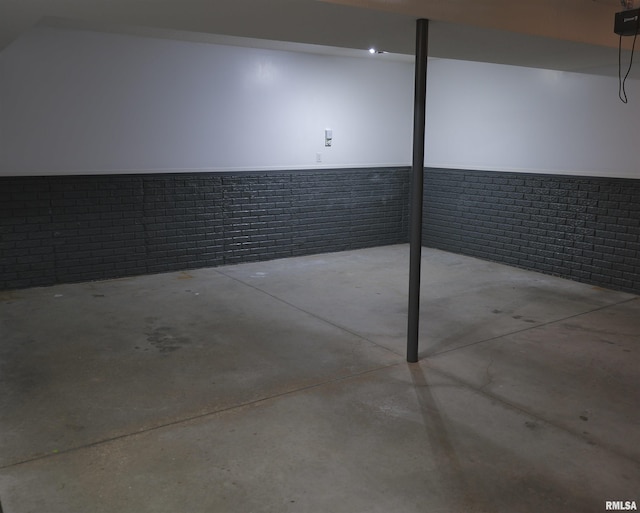 basement with brick wall