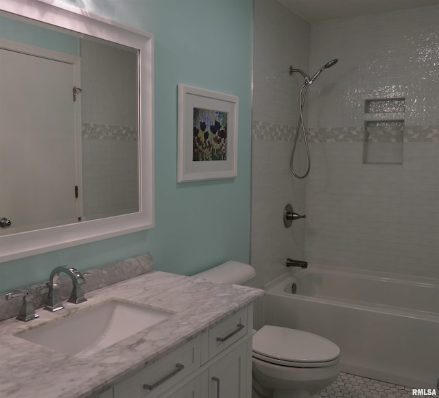 full bathroom featuring tile patterned flooring, vanity, shower / bath combination, and toilet