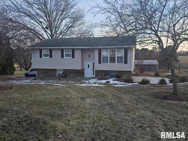 bi-level home featuring a lawn