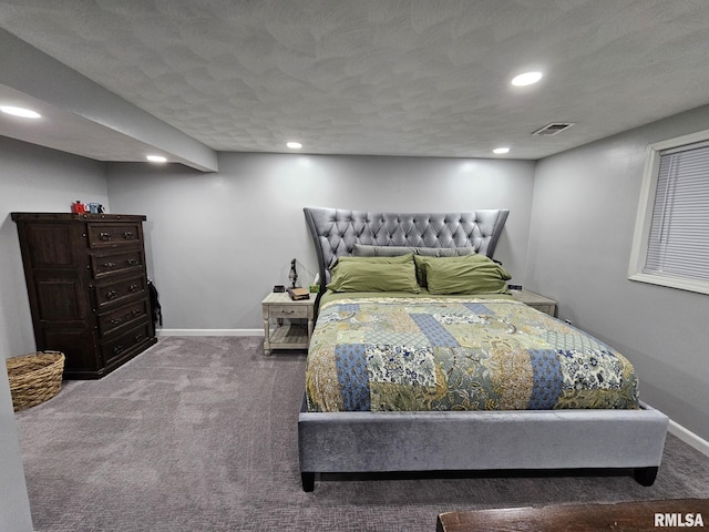 bedroom featuring carpet flooring and a textured ceiling