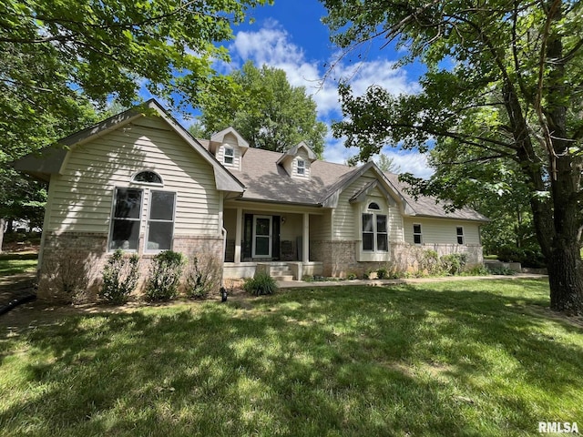 new england style home featuring a front yard