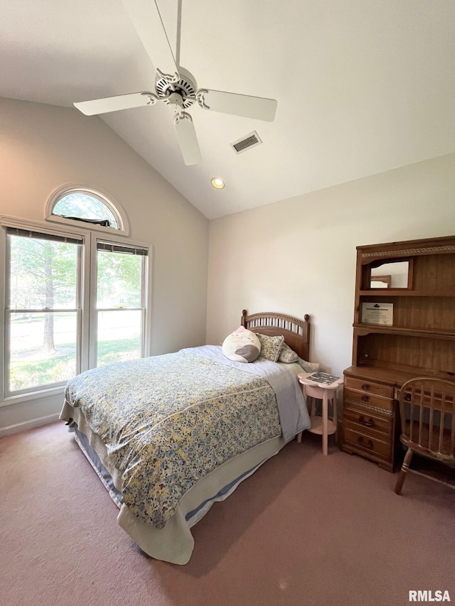 carpeted bedroom featuring vaulted ceiling and ceiling fan