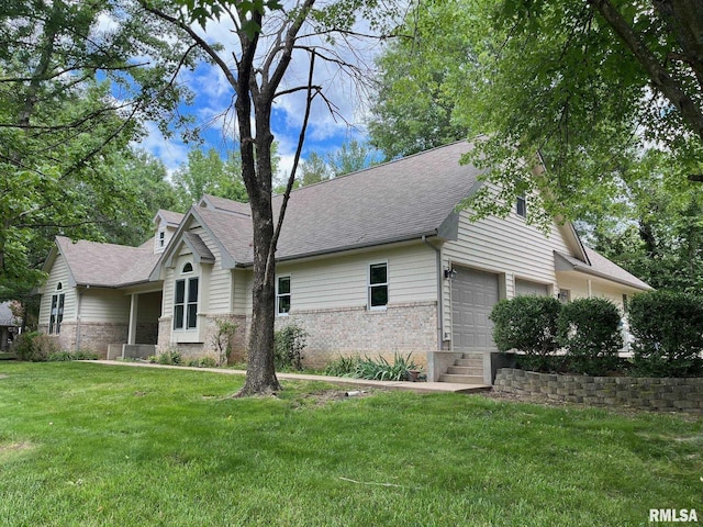 view of front facade with a garage and a front yard