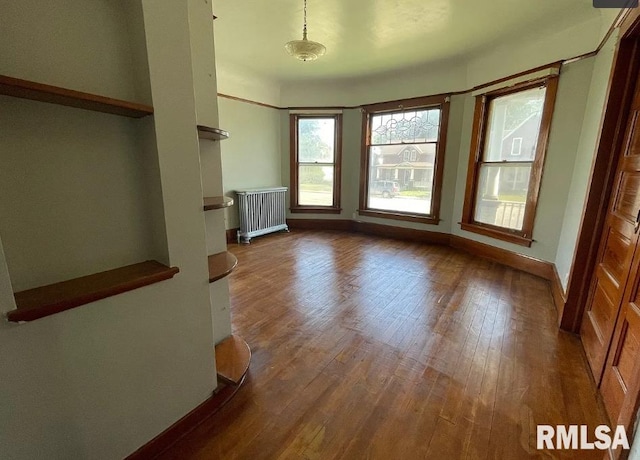 interior space featuring hardwood / wood-style flooring and radiator