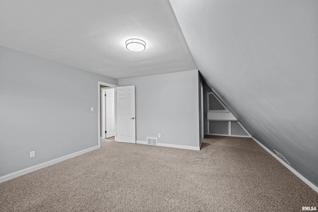 bonus room featuring carpet and lofted ceiling