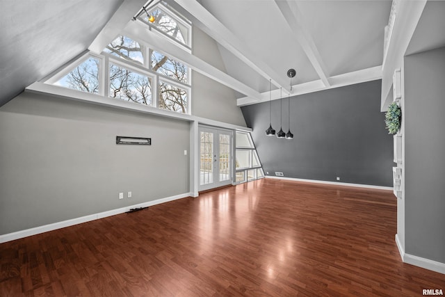 unfurnished living room with beamed ceiling, french doors, and dark hardwood / wood-style floors