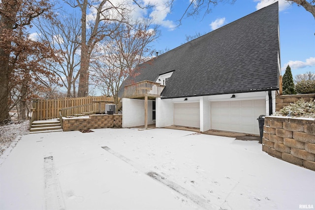 yard covered in snow featuring a balcony