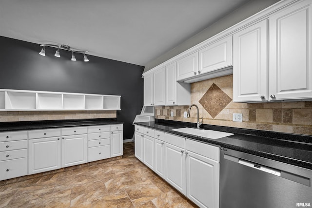 kitchen with tasteful backsplash, dishwasher, white cabinets, and sink