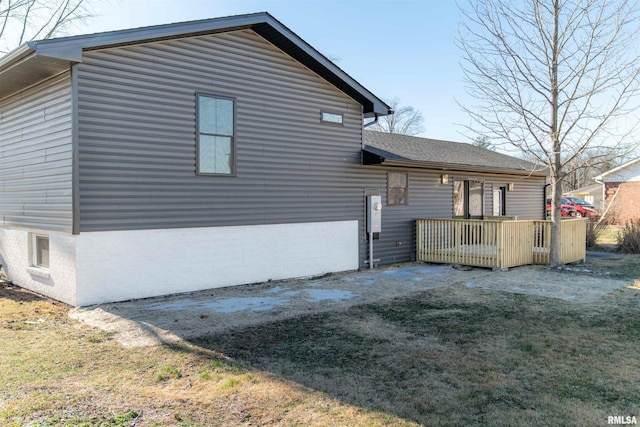 rear view of property with a yard