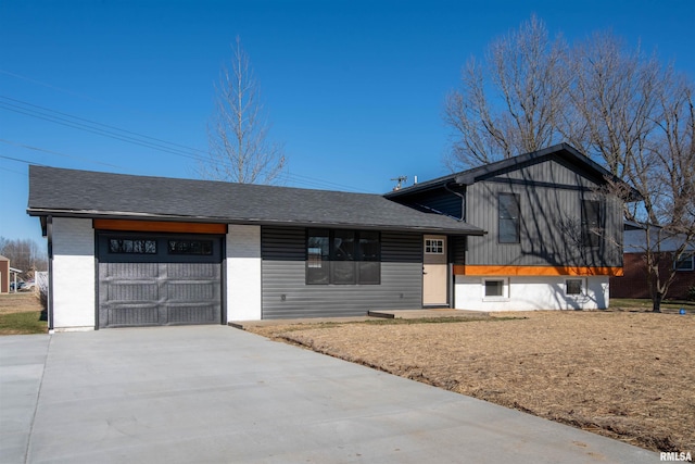 view of front of house with a garage and a front yard