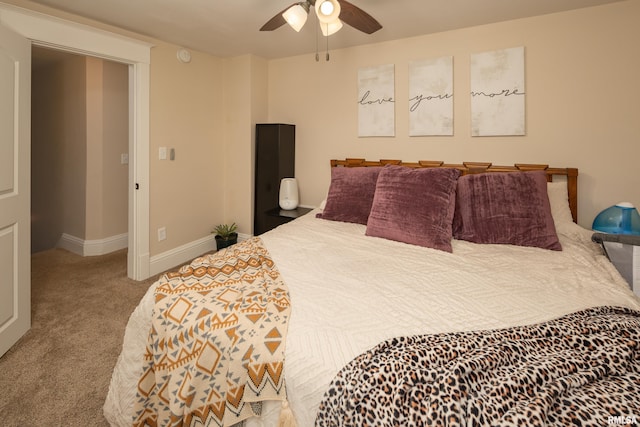 bedroom with ceiling fan and light carpet