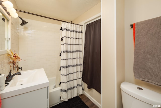 full bathroom featuring shower / tub combo with curtain, vanity, wood-type flooring, and toilet