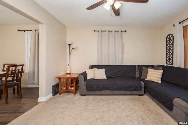 living room with carpet flooring and ceiling fan