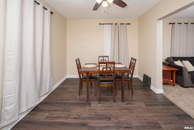 dining room featuring dark hardwood / wood-style flooring and ceiling fan