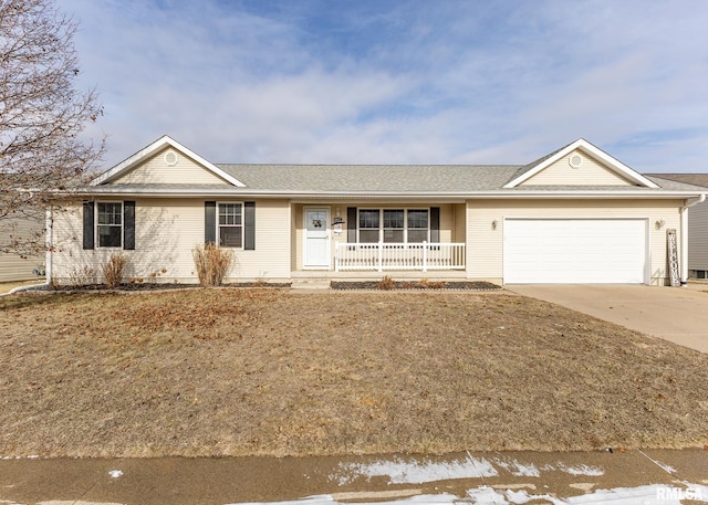 single story home featuring covered porch and a garage