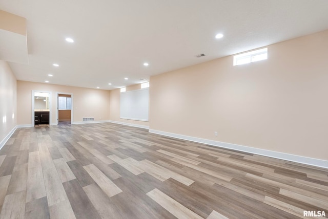 basement featuring light wood-type flooring