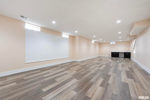 basement featuring hardwood / wood-style floors