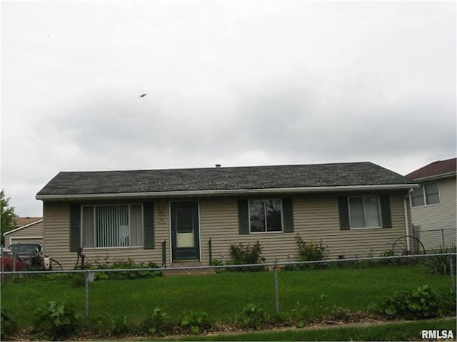 ranch-style home with a front lawn