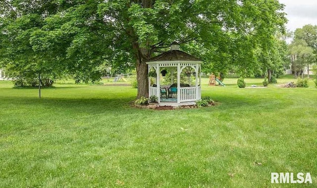 view of yard with a gazebo and a playground