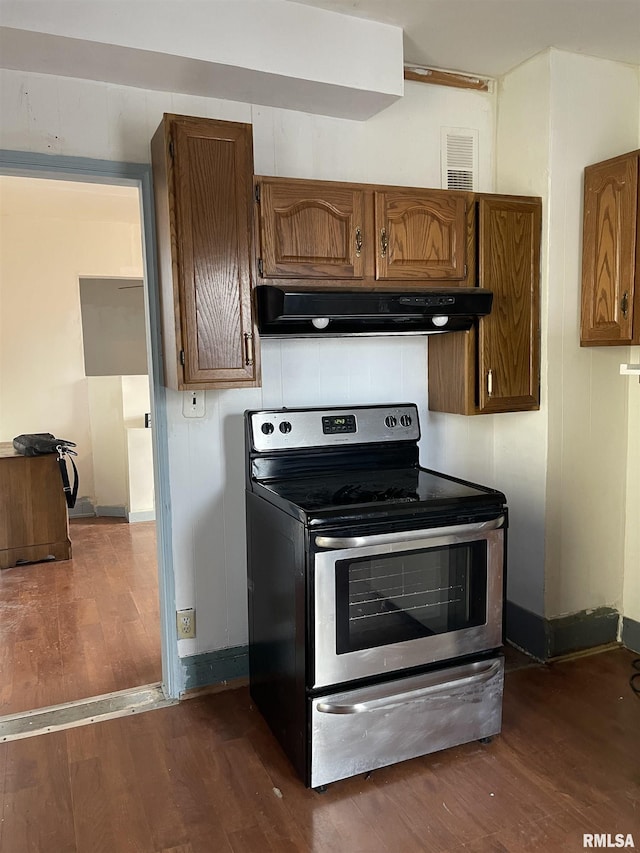 kitchen featuring dark hardwood / wood-style floors and stainless steel range with electric stovetop