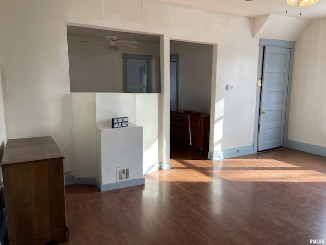 empty room featuring ceiling fan and dark hardwood / wood-style floors