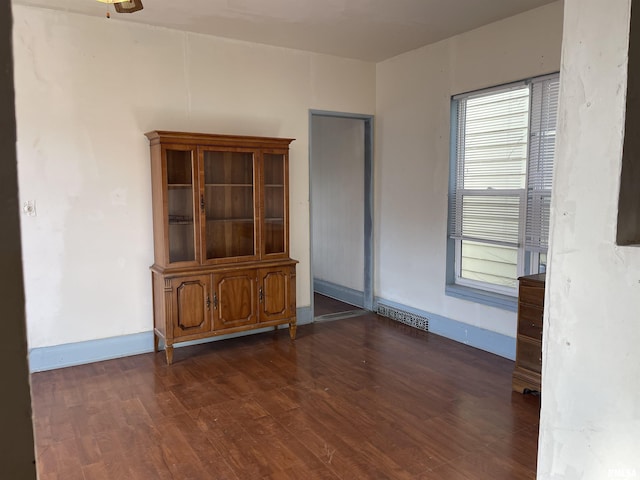 empty room featuring dark hardwood / wood-style floors