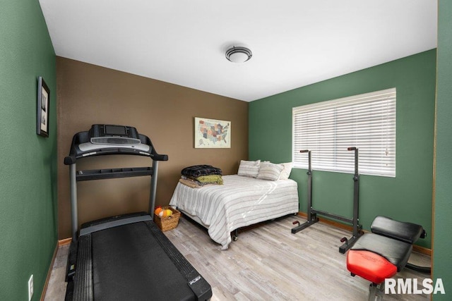 bedroom with wood-type flooring